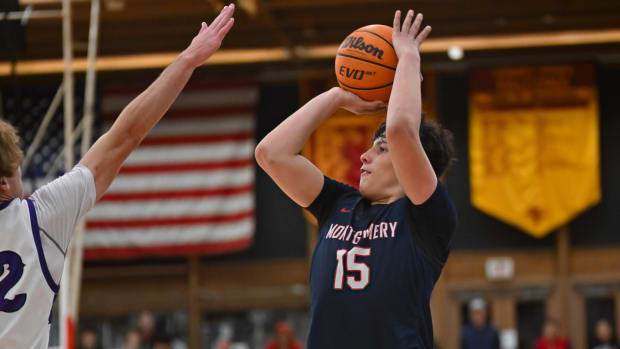 Montgomery's JJ Sanchez shoots over the reach of Carlsbad's Jett Kenady in December's matchup